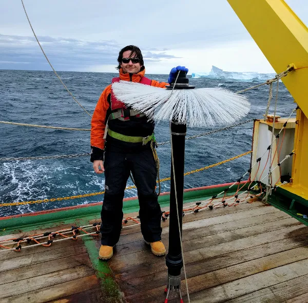 Lamont Oceanographer Pierre Dutrieux in Terra Nova Bay Antarctica with Instrument that Detects Fluctuations in Ocean Water