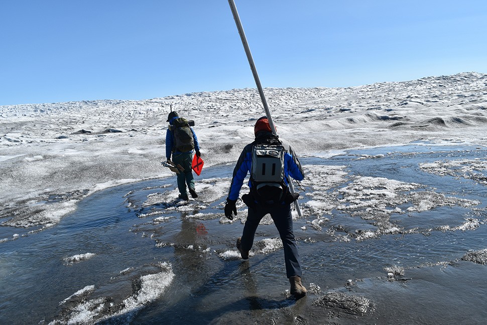 Researchers Marco Tedesco of Lamont and Matthew Cooper of UCLA Step onto Lower Reaches of Ice on Greenland Ice sheet - Kevin Krajick